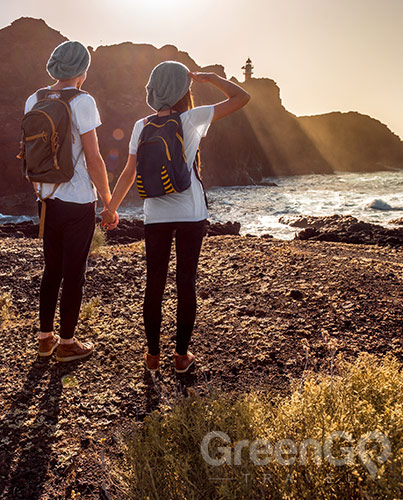 Couple observing Galapagos shore Couple observing Galapagos shore